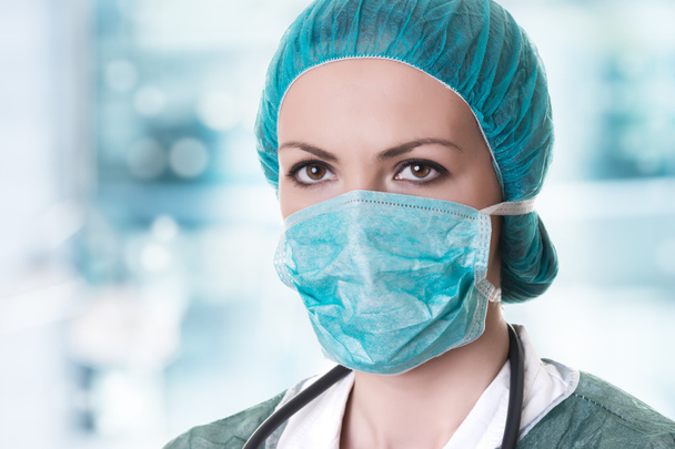doctor in mask with stethoscope - Foto, Bild