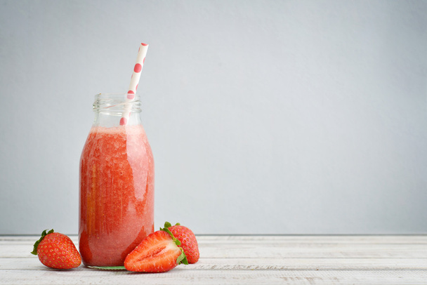 Strawberry  smoothie in retro bottle - Photo, image