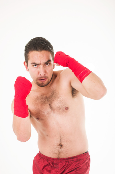 martial arts fighter wearing red shorts and wristband - Foto, immagini