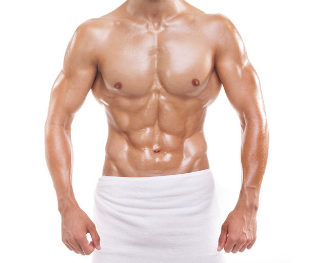 Muscular man posing in towel - Foto, Imagen