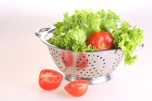 lettuce and tomatoes in the time recommended on white background - Foto, Imagen