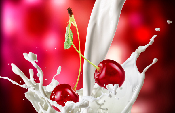 Sweet cherries with milk splash on bright abstract background - Photo, image