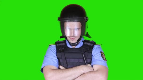Rendőrség sisakok és golyóálló mellény, egy zöld háttér - Felvétel, videó