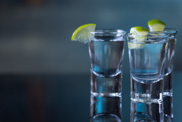 Vodka drinks with lemon and lime - Photo, Image