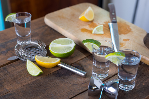 Vodka drinks with lemon and lime - Fotó, kép