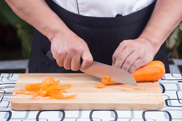 Chef is cutting carrots - Photo, Image