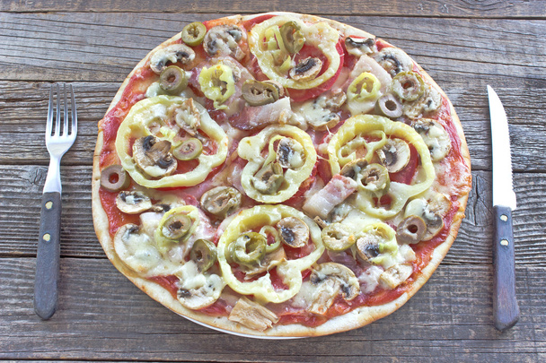 Fresh pizza served on wooden table - Photo, Image