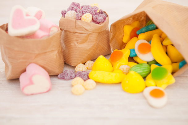 Paper bags stuffed with candies - Photo, Image
