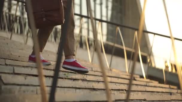 male sneakers down the stairs - Materiaali, video