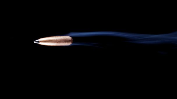 Copper bullet with smoke - Photo, image