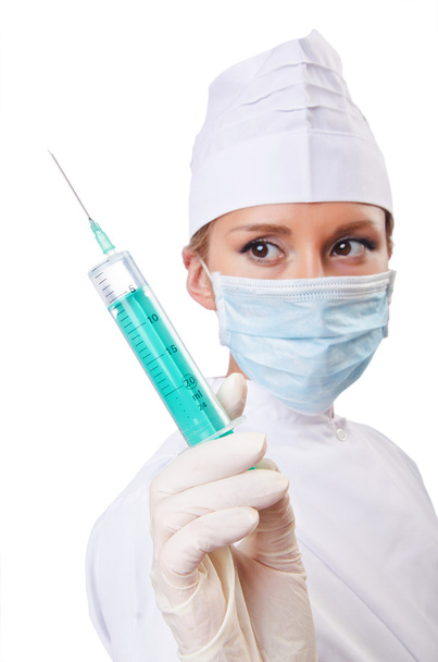 Woman doctor with syringe on white - 写真・画像