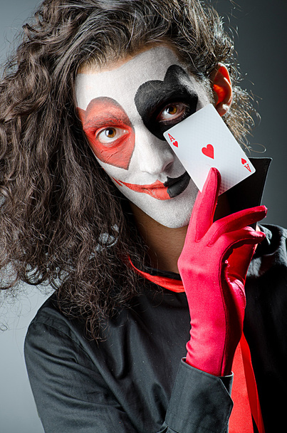 Joker with face mask in studio - Photo, Image