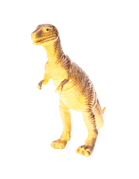 Beyaz bir arka plan üzerinde kahverengi plastik dinozor oyuncak - Fotoğraf, Görsel