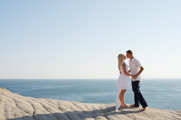 Couple kissing by the sea - Photo, Image