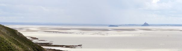 Mont Saint Michel Bay at low tide with the Abbey silhouetteat th - Photo, Image