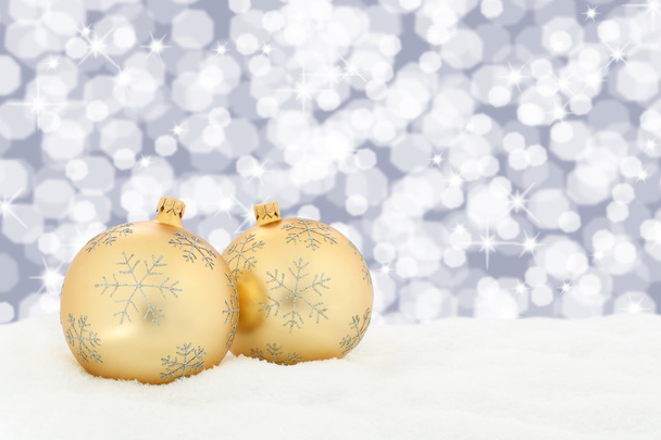Різдвяні золоті кульки прикраса фону зі сніговими вогнями
 - Фото, зображення