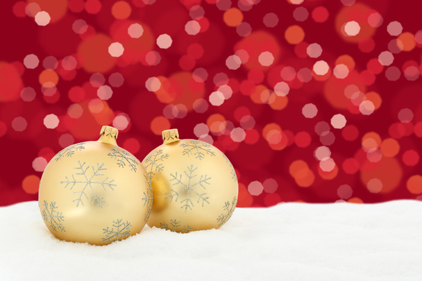Christmas golden balls red background decoration with snow light - Photo, Image