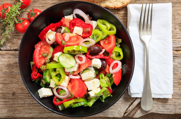 Greek salad on wooden background - Photo, Image