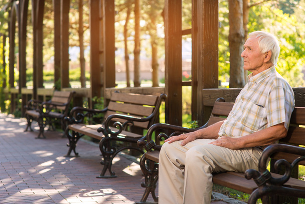 Senior man on park bench. - Photo, Image