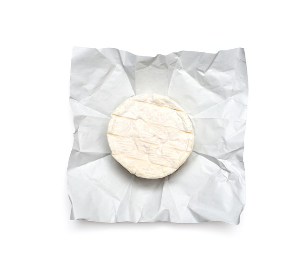 camembert cheese on wrapping paper - Fotoğraf, Görsel