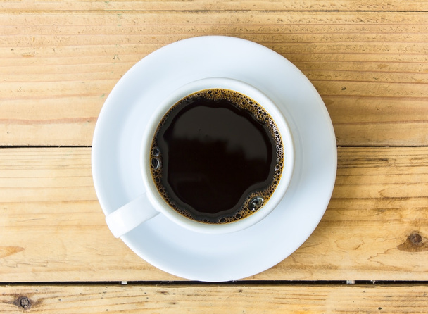 Kaffeetasse auf Holztischhintergrund - Foto, Bild