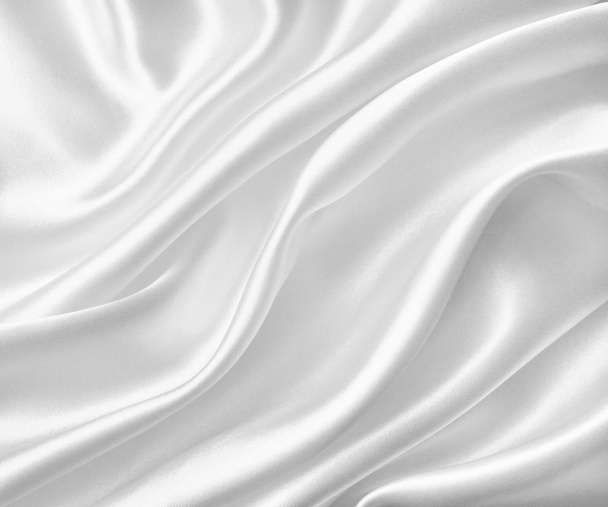 Smooth elegant white silk or satin texture as wedding background - Foto, afbeelding