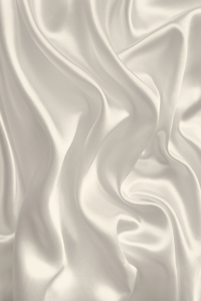 Smooth elegant golden silk or satin texture as background. In Se - Фото, изображение