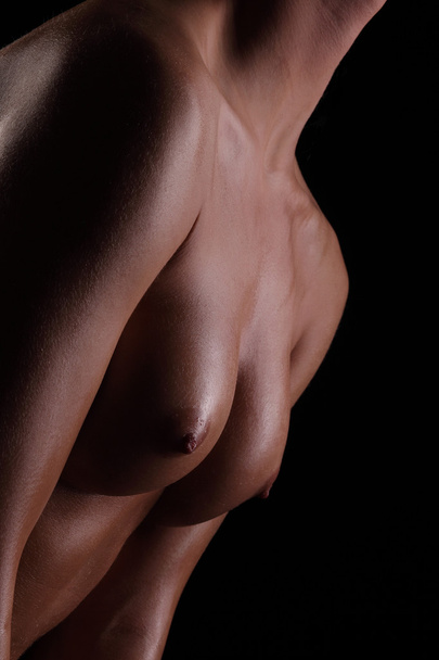 closeup of topless sexy beautiful young woman on dark background - Foto, afbeelding