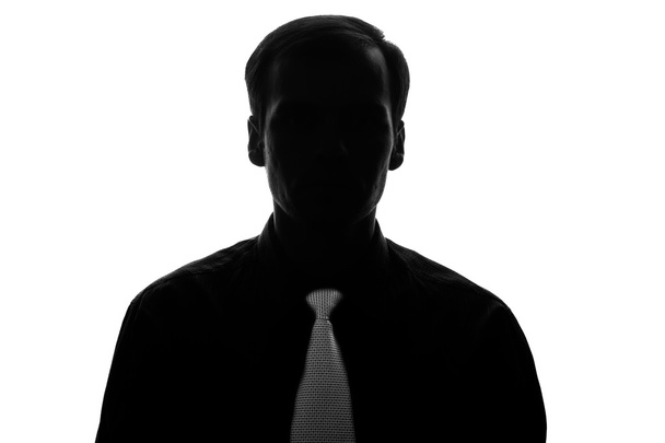 Portrait young man in suit, tie in silhouette - front view - Photo, Image