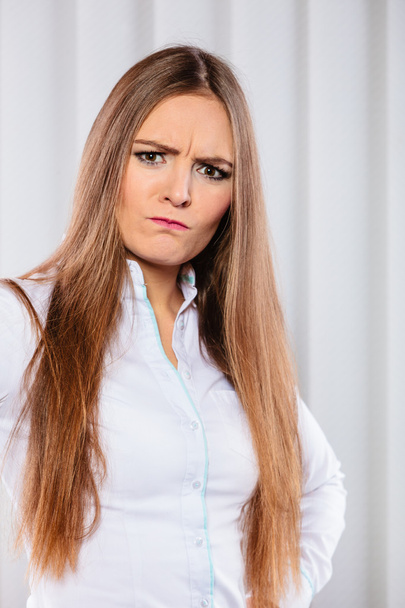 Angry and irritated business woman in office. - 写真・画像