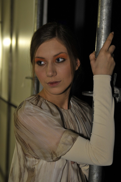 MOSCOW - MARCH 24: A model gets ready backstage at the Biryukov for Fall Winter 2012 presentation during MBFW on March 24, 2012 in Moscow, Russia - Photo, Image