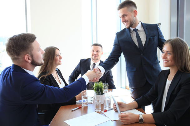 Business people shaking hands, finishing up a meeting  - Фото, зображення