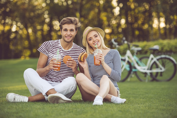 Couple resting in park - Photo, Image