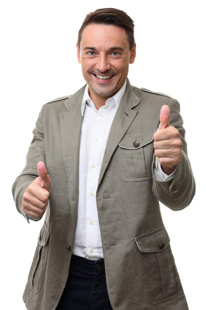 happy smiling man gesturing thumbs up. Isolated - 写真・画像