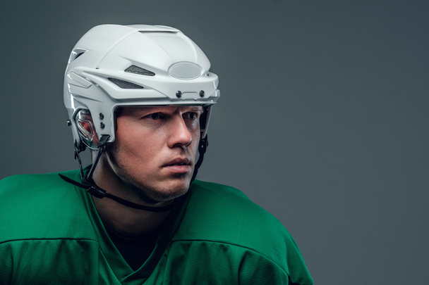 Hockey player with a helmet - Foto, Bild