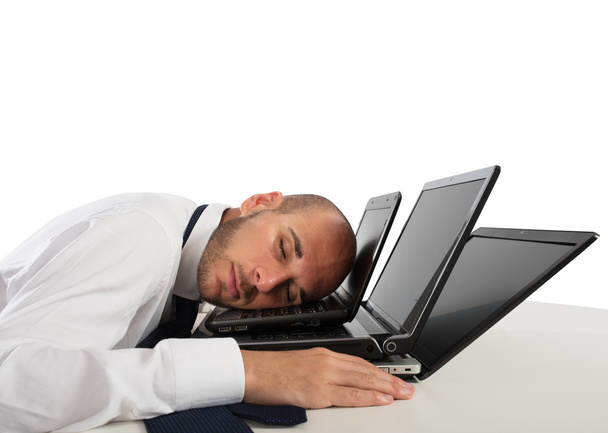 Zakenman slapen over computers  - Foto, afbeelding