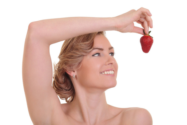 イチゴと美しい若いブロンドの女性 - 写真・画像