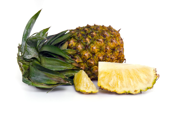 Fresh pineapple with slices isolated on white - Photo, Image