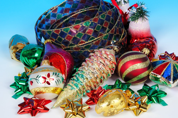 Glass Christmas tree decorations with colourful ribbons and bows. - Фото, зображення