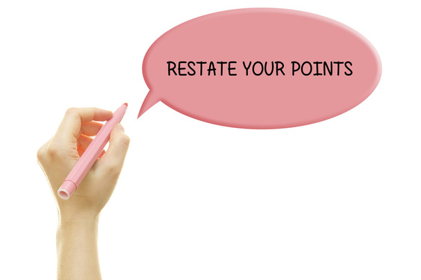 cropped shot of person writing restate your points in speech bubble isolated on white - Photo, Image