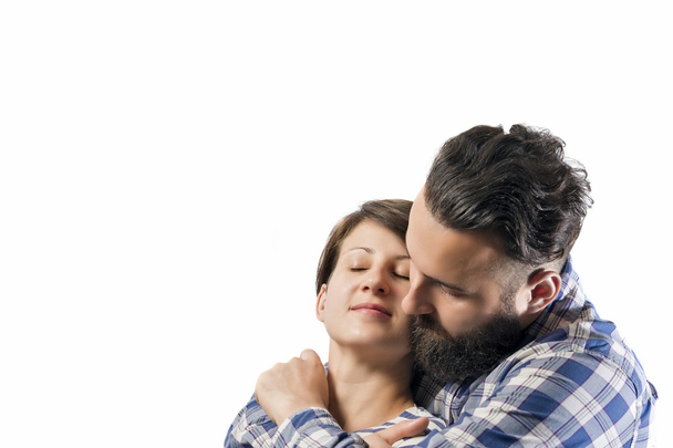 Embrace of bearded guy and girl - 写真・画像