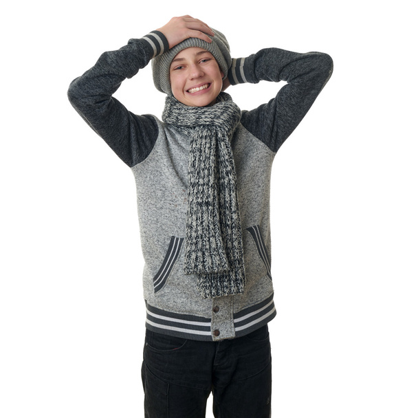 Cute teenager boy in gray sweater over white isolated background - Φωτογραφία, εικόνα