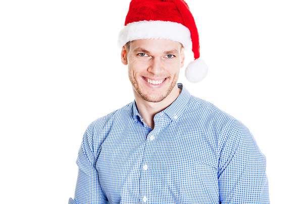 Caucasian man wearing christmas hat for santa. Young businessman isolated on white background. Successful boy wearing Santa Claus hat - Fotografie, Obrázek