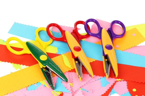 Colorful zigzag scissors with color paper isolated on white - Фото, зображення