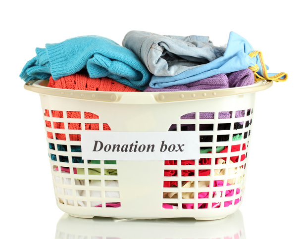 Donation box with clothing isolated on white - Photo, image