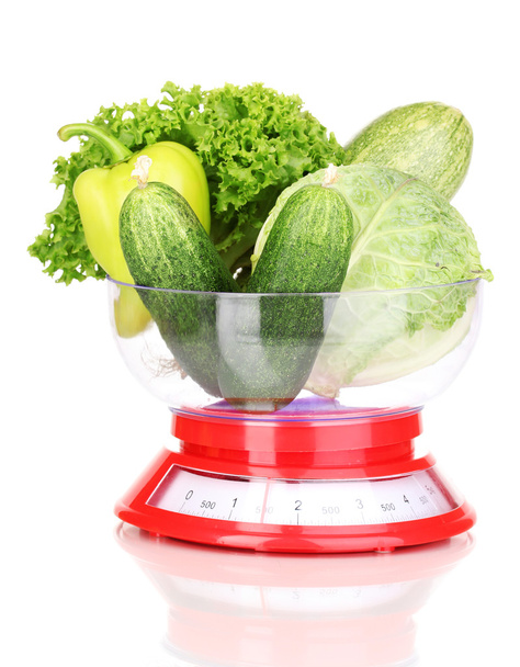 fresh green vegetables in scales isolated on white - Valokuva, kuva