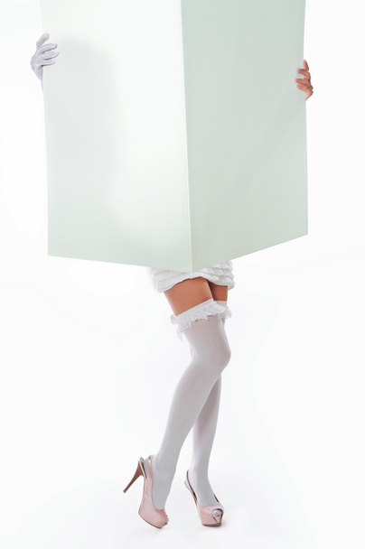 girl holding a large sheet of paper - Φωτογραφία, εικόνα