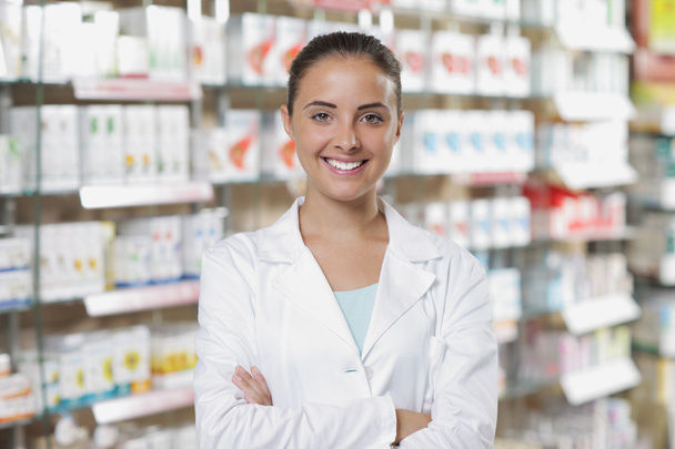 Portrait of Smiling Woman Pharmacist in Pharmacy - 写真・画像