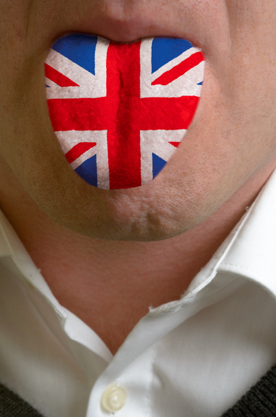 malowany człowiek języka w gunited Brytania flagę symbolizującą knowle - Zdjęcie, obraz
