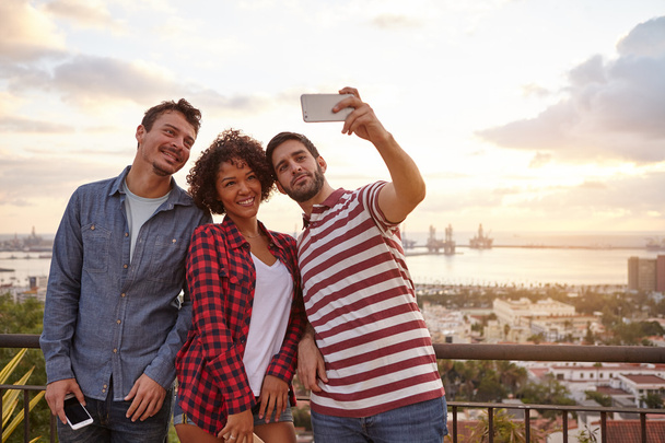 Three young friends taking selfie - Foto, Imagen